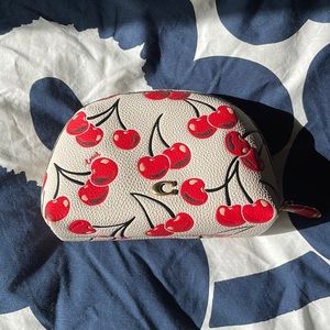 Like new coach medium leather pouch cherry print
